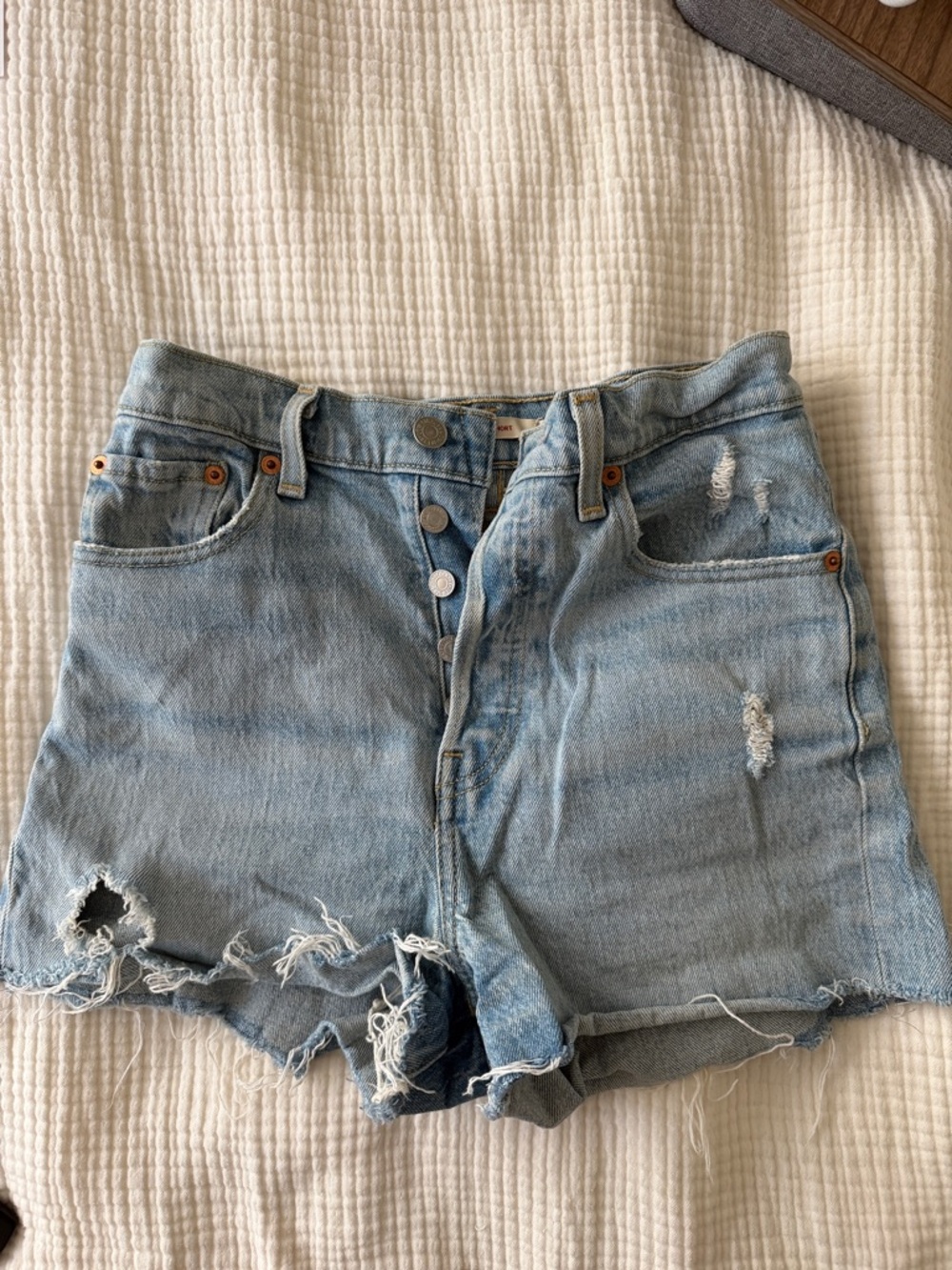 High Waisted Light Wash Distressed Women’s Levi’s Shorts